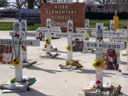 Crosses dedicated to the 21 victims of the 2022 mass shooting at Robb Elementary are place