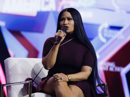 PHOENIX, ARIZONA - DECEMBER 21: Surprise guest Nicki Minaj is interviewed by Erika Kirk on