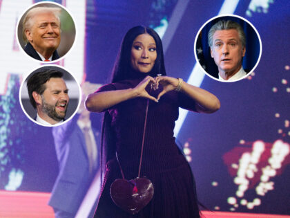 PHOENIX, ARIZONA - DECEMBER 21: Nicki Minaj enters the stage as the surprise guest on the