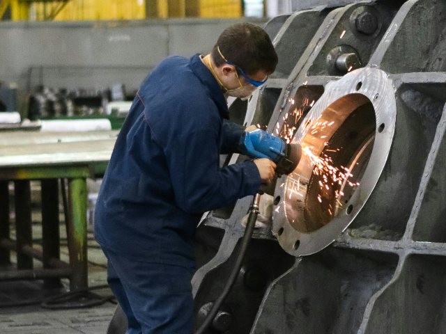 Man Welding Round Frame