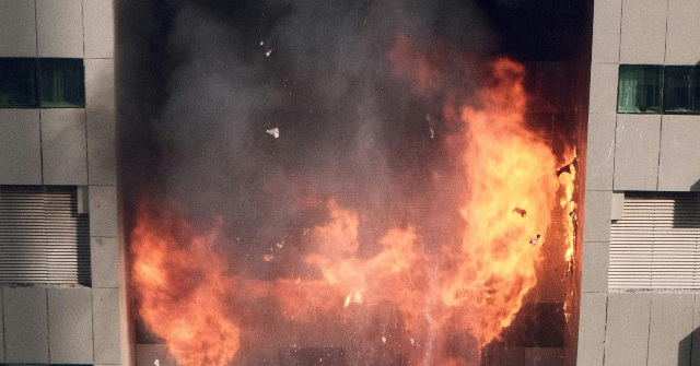 Video: Woman Braves Raging Apartment Fire to Save Two Dogs