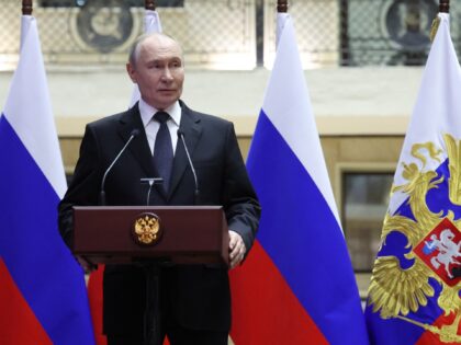 In this pool photograph distributed by the Russian state agency Sputnik, Russia's Presiden