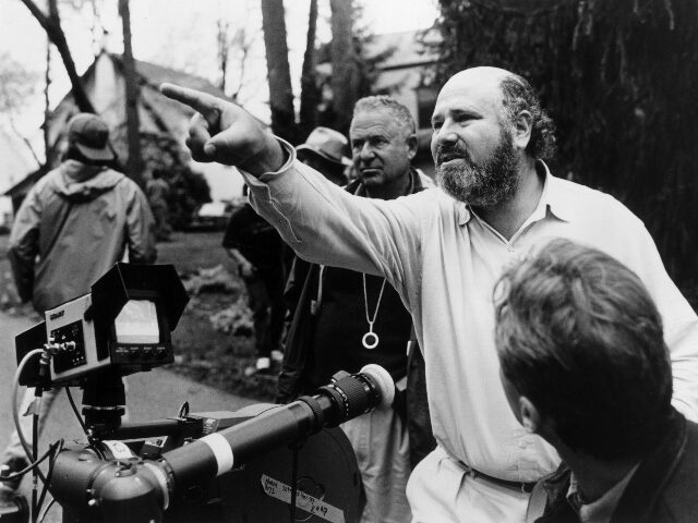 robreinerdirecting 1994: American director, producer, and actor Rob Reiner gestures near a camera while crew