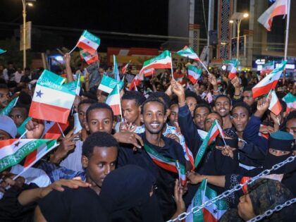 Residents wave Somaliland flags as they gather to celebrate Israel's announcement rec