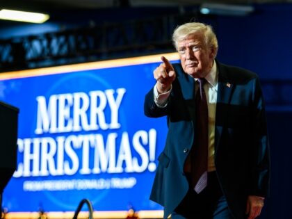 President Donald Trump gestures to the crowd after delivering remarks on the economy at th