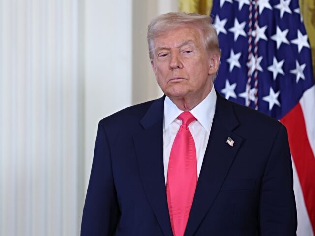 WASHINGTON, DC - NOVEMBER 13: U.S. President Donald Trump listens as first lady Melania Tr