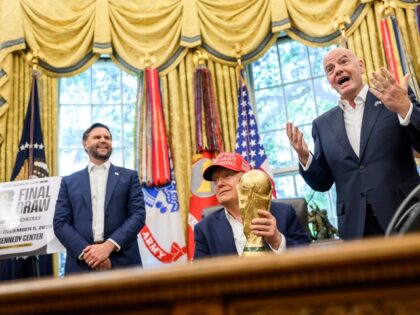 President Donald Trump, flanked by Vice President JD Vance and FIFA President Gianni Infan