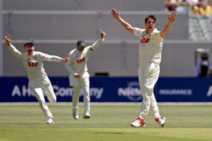 Australia's Pat Cummins (right) celebrates taking the wicket of England's Zak Cr