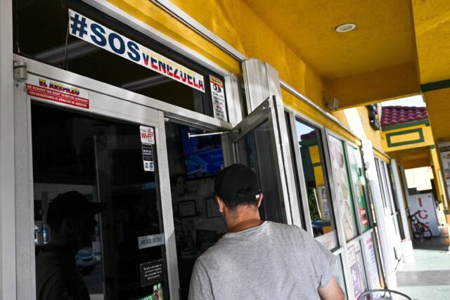 A man enters a Venezuelan food mart in Doral, Florida, where 40 percent of the population