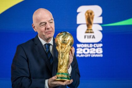 FIFA president Gianni Infantino poses with the World Cup trophy last month