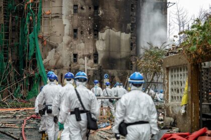 Hong Kong Police handout photo shows officers at the site of the deadly fire at Wang Fuk C