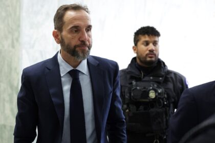 Former Special Counsel Jack Smith (L) arrives to testify behind closed doors to the House