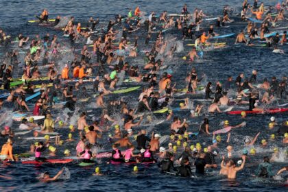 Surfers and swimmers joined in a tribute to the victims of Sunday's Bondi Beach attac