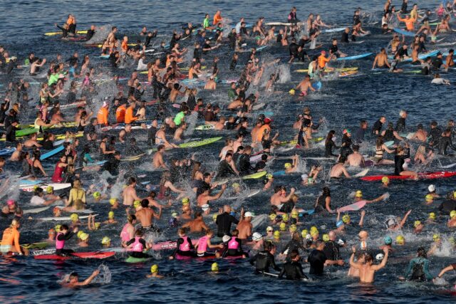 Surfers and swimmers joined in a tribute to the victims of Sunday's Bondi Beach attac