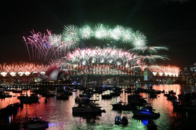 Sydney rang in the New Year with its customary fireworks display after pausing for a minut