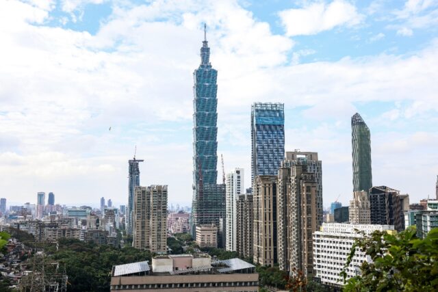 The Taipei 101 building is seen among residential and commercial buildings in Taipei in De