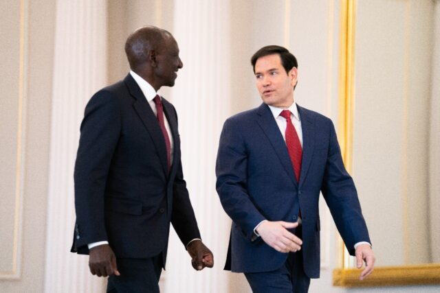 US Secretary of State Marco Rubio speaks with Kenyan President William Ruto before signing