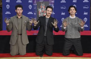 Jonas Brothers leave hand and foot prints at TCL Chinese Theater
