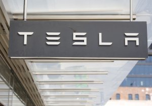 Tesla shares close at record high $489.88