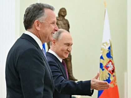 In this pool photograph distributed by Russian state agency Sputnik, Russia's President Vl