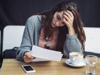 young woman reading letter