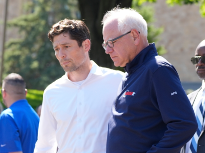 Minnesota Gov. Tim Walz, right, walks with Minneapolis Mayor Jacob Frey outside the Annunc