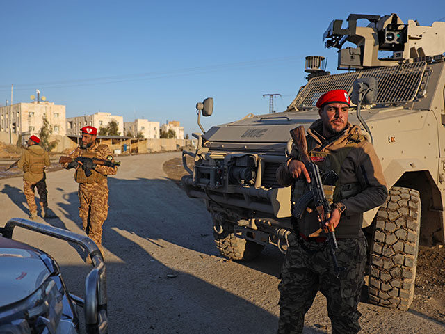 Title: Syria Kurds Clashes Image ID: 26019521406906 Article: Syrian government forces stan