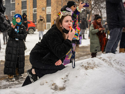 AP26022131524902 Title: Immigration Enforcement Minnesota Image ID: 26022131524902 Article: People record a