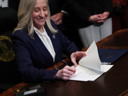 Virginia Governor Abigail Spanberger signs executive orders after being sworn into office