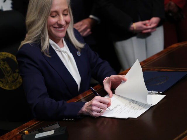 Virginia Governor Abigail Spanberger signs executive orders after being sworn into office