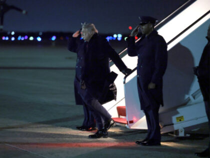 U.S. President Donald Trump walks off Air Force One on January 19, 2026 in in Joint Base A