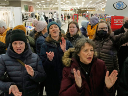 Community members and neighbors of people detained by ICE protest at a Target store, Monda
