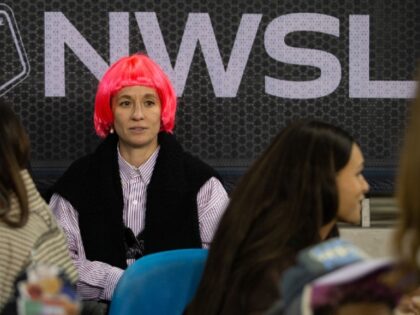 Megan Rapinoe looks on during