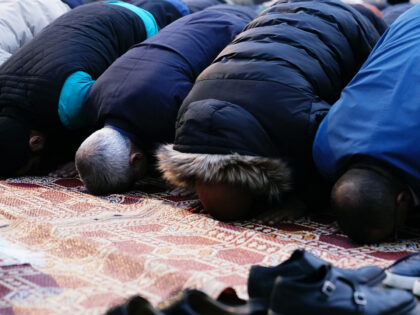 Mayor of London Sadiq Khan (centre-left) praying during an open Iftar to mark the final we
