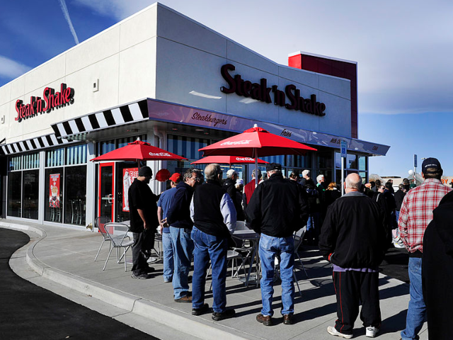 GettyImages-161198894 A crowd of about 30 people hang out in front of the Steak'n Shake in Centennial Thursday m