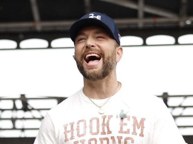 Chris Lane performs on stage during Daytime Village at the 2024 iHeartCountry Festival pre