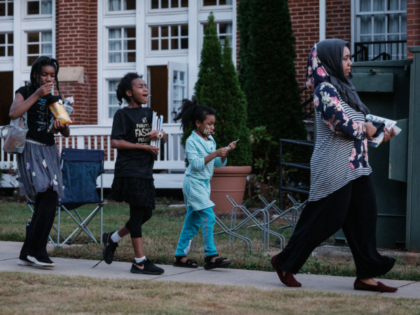 GettyImages-2182509381 A voter leaves with her daughters from a polling station in Clarkston, Georgia, on Electio
