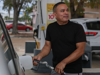 MIAMI, FLORIDA - APRIL 10: Jaime Zelaya pumps gas at a Shell station on April 10, 2025 in