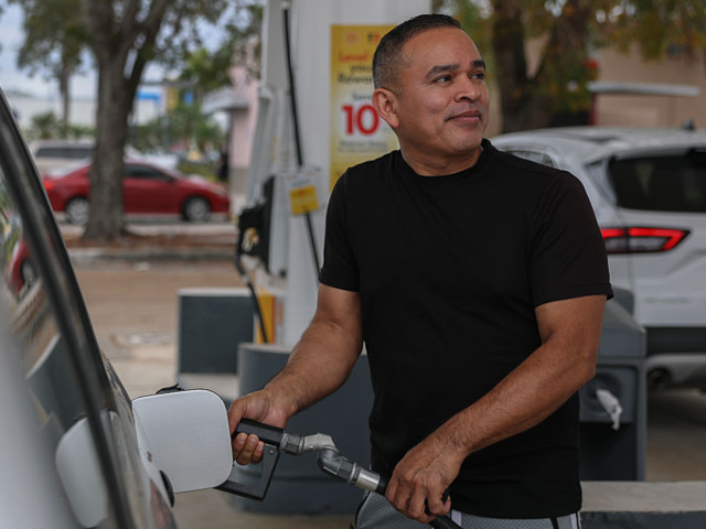 MIAMI, FLORIDA - APRIL 10: Jaime Zelaya pumps gas at a Shell station on April 10, 2025 in