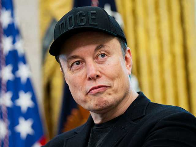 Elon Musk looks on during a news conference with US President Donald Trump in the Oval Off