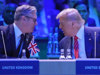 Britain's Prime Minister Keir Starmer (L) speaks with US President Donald Trump at a North