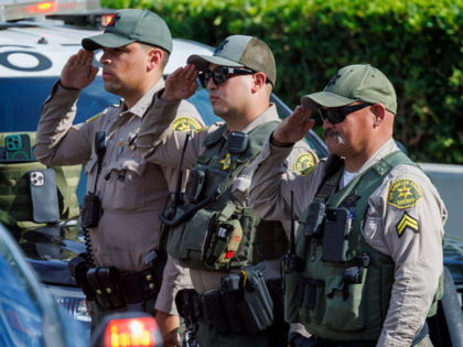 LOS ANGELES , CA - JULY 18, 2025: L.A. County Sheriff Deputies salute as a law enforcement