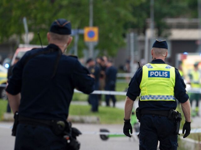 Police work at the scene outside a mosque in Orebro after a shooting where several people