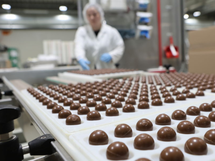 05 September 2025, Saxony-Anhalt, Wernigerode: View of pallets of filled chocolate balls a