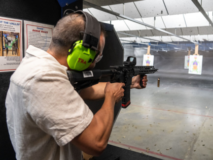 AUSTIN, TEXAS - OCTOBER 17: Kristian Frandsen of Denmark shoots an AR-15style rifle at The