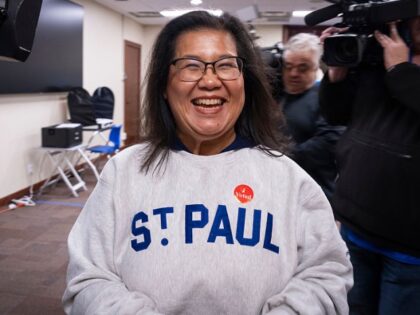 Minnesota State Rep. Kaohly Her, who is running for St. Paul mayor, is filmed by the media