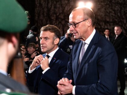 German Chancellor Friedrich Merz greets French President Emmanuel Macron upon his arrival