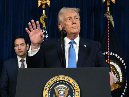 US President Donald Trump speaks to the press as Secretary of State Marco Rubio looks on f