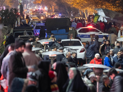 A traffic police vehicle blocks a street to a square during an unveiling ceremony of a sta