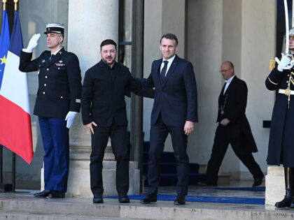 Volodymyr Zelenskiy, Ukraine's president, left, with Emmanuel Macron, France's p